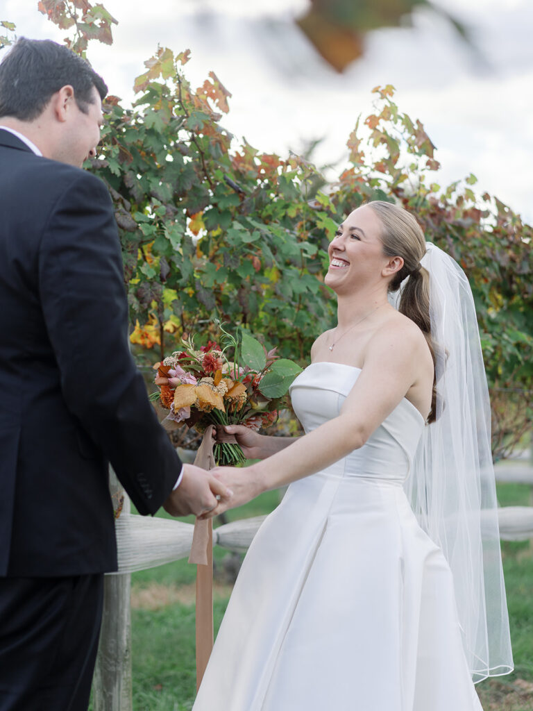 A Veritas wedding couples amongst the vines in the vineyards on their wedding day