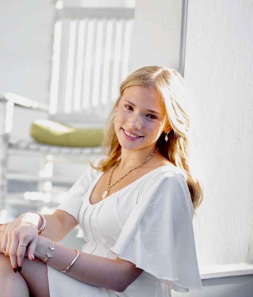 A headshot of a young female