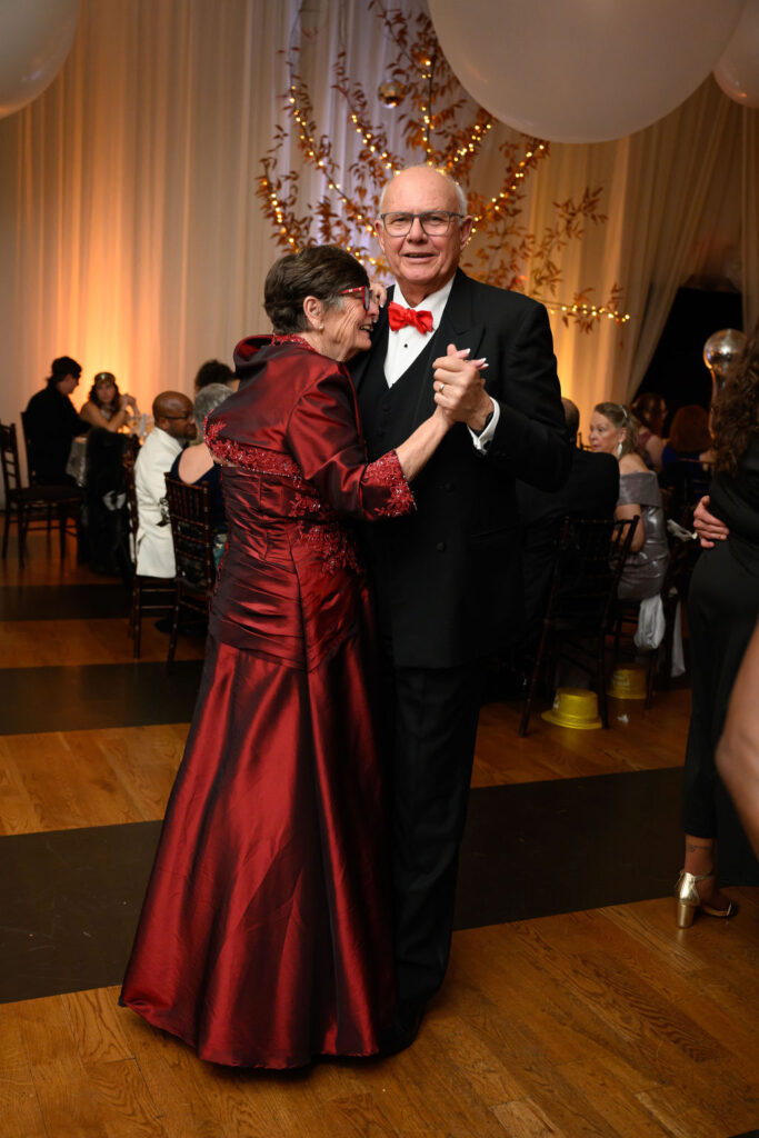 A couple dancing at the Veritas NYE Masked Ball